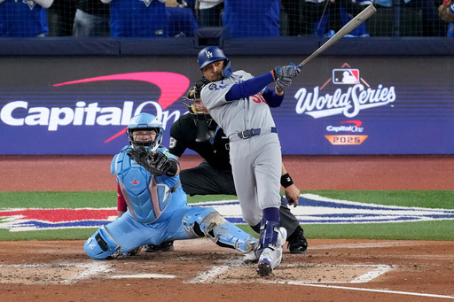 Los Angeles Dodgers' Mookie Betts follows through on his two run base hit against the Toronto Blue Jays during the third inning in Game 6 of baseball's World Series, Friday, Oct. 31, 2025, in Toronto. (AP Photo/Ashley Landis) Los Angeles Dodgers' Mookie Betts follows through on his two run base hit against the Toronto Blue Jays during the third inning in Game 6 of baseball's World Series, Friday, Oct. 31, 2025, in Toronto. (AP Photo/Ashley Landis)
