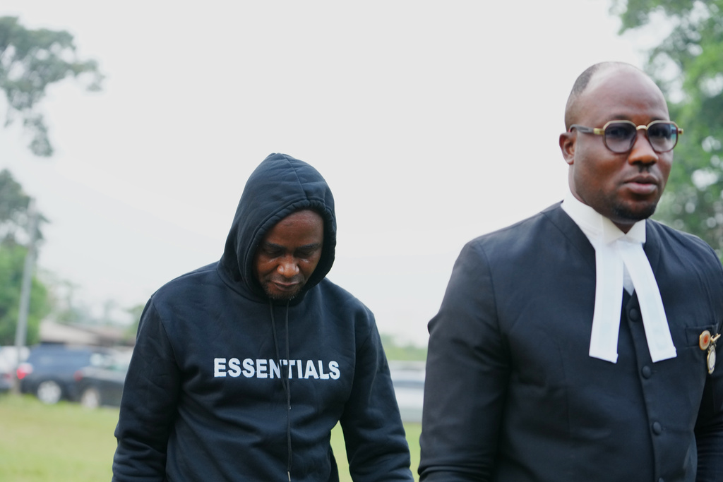 CORRECTS INFO TO FORMER HEAVYWEIGHT CHAMPION Adeniyi Mobolaji Kayode, 46, the driver in a car crash that injured former heavyweight champion Anthony Joshua and killed his two friends in Nigeria, arrives with his lawyer for a hearing at the magistrate court, in Sagamu, south west Nigeria, Tuesday, Jan. 20, 2026. (AP Photo/Sunday Alamba)