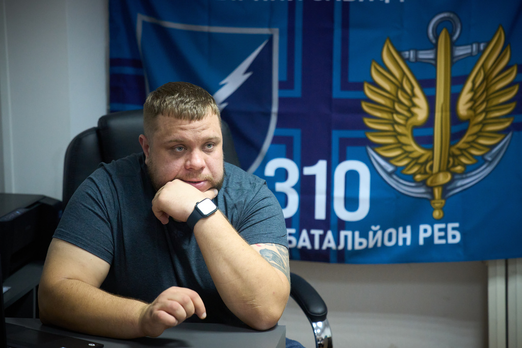 Commander of the 310th Battalion, Dmytro Liashok, a 16-year military veteran and one of Ukraine's early pioneers in electronic warfare, talks with the Associated Press in the frontline city of Kherson, Southern Ukraine, Sunday, Nov. 2, 2025. (AP Photo/Efrem Lukatsky)