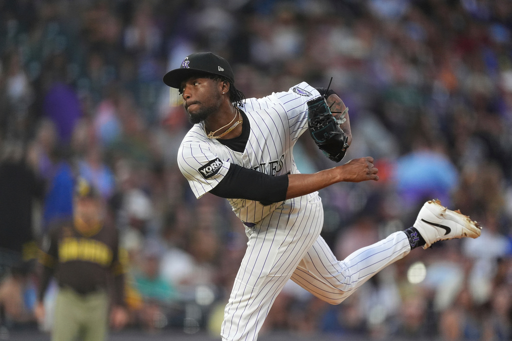 FILE - Colorado Rockies relief pitcher Angel Chivilli (57) in the fourth inning of a baseball game, Sept. 6, 2025, in Denver. (AP Photo/David Zalubowski, File)