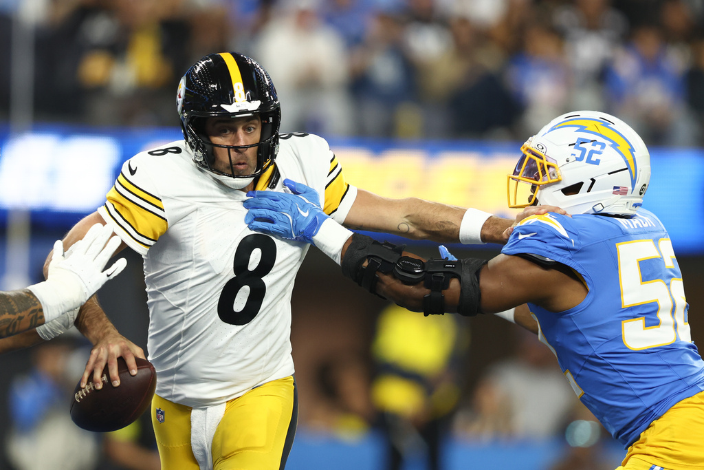 Los Angeles Chargers linebacker Khalil Mack (52) grabs Pittsburgh Steelers quarterback Aaron Rodgers (8) during the first half of an NFL football game Sunday, Nov. 9, 2025, in Inglewood, Calif. (AP Photo/Jessie Alcheh)