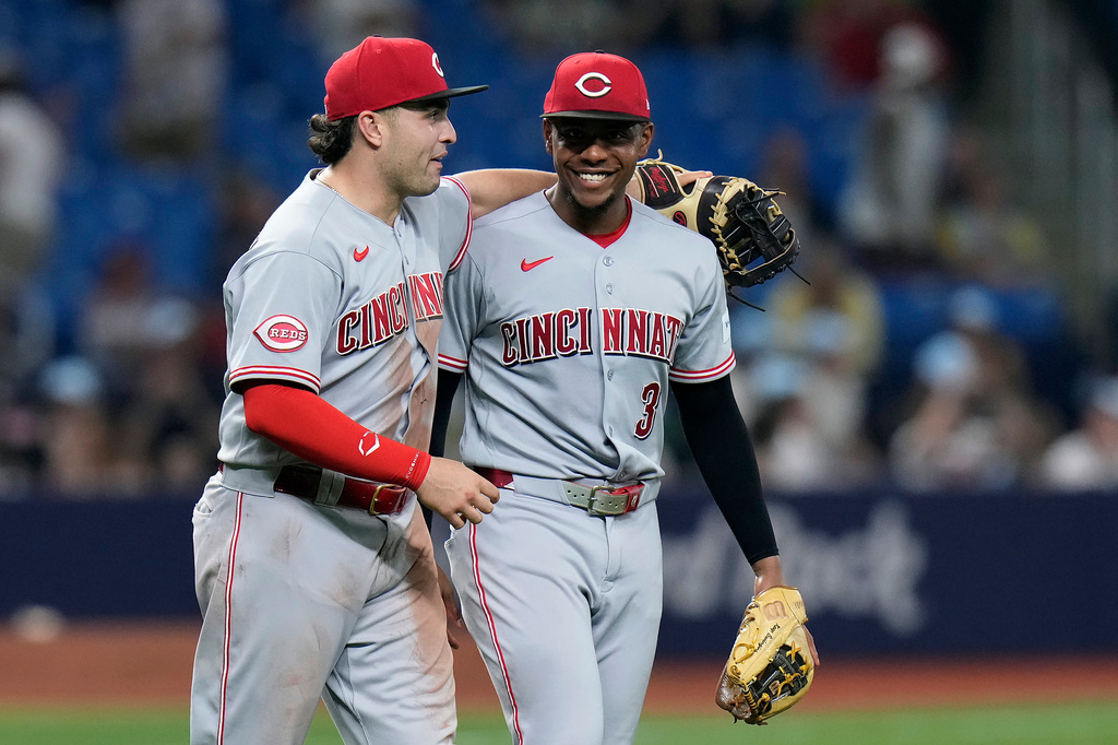 Cincinnati Reds first baseman Sal Stewart and third baseman Ke'bryan Hayes (3) celebrate after the team defeated the Tampa Bay Rays during a baseball game Monday, April 20, 2026, in St. Petersburg, Fla. (AP Photo/Chris O'Meara)