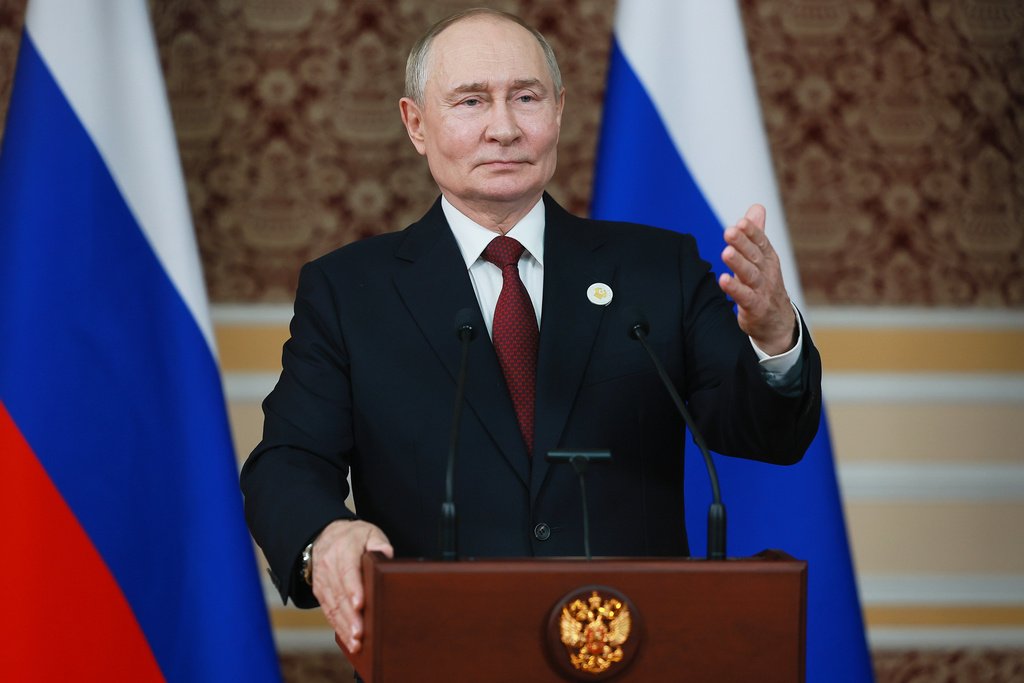Russian President Vladimir Putin holds a news conference after the summit of the Commonwealth of Independent States in Dushanbe, Tajikistan, Friday, Oct. 10, 2025. (Vladimir Smirnov, Sputnik, Kremlin Pool Photo via AP)