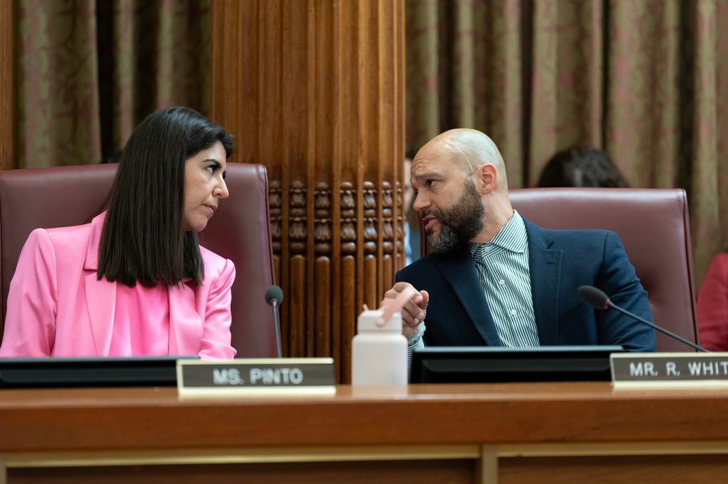 D.C. Council members Brooke Pinto speaks with Robert White Jr. during the D.C. Council hearing on the Fiscal Year 2027 budget at the Wilson Building, City Hall, Tuesday, June 9, 2026, in Washington. (AP Photo/Jose Luis Magana)