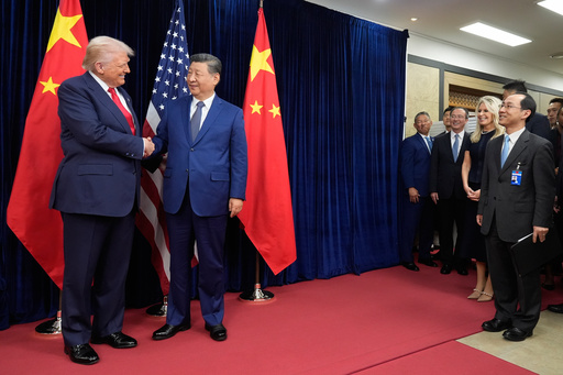 President Donald Trump, left, and Chinese President Xi Jinping, second left, shake hands before their meeting at Gimhae International Airport in Busan, South Korea, Thursday, Oct. 30, 2025. (AP Photo/Mark Schiefelbein) President Donald Trump, left, and Chinese President Xi Jinping, second left, shake hands before their meeting at Gimhae International Airport in Busan, South Korea, Thursday, Oct. 30, 2025. (AP Photo/Mark Schiefelbein)