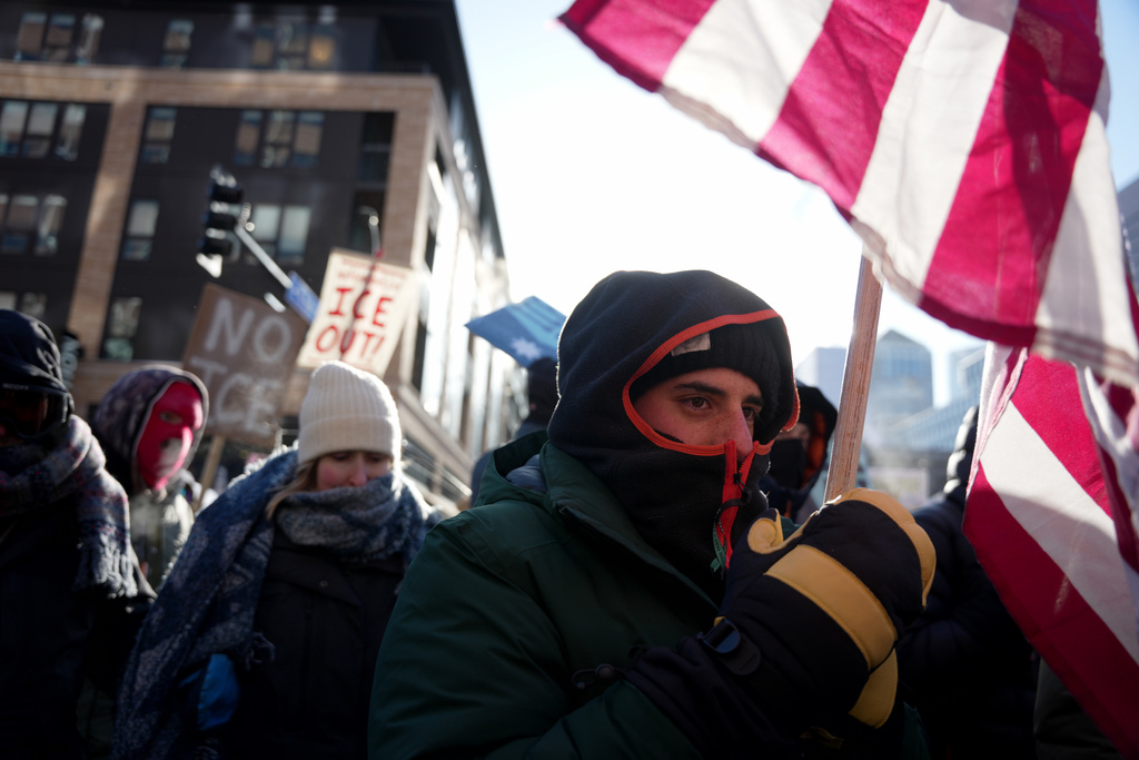 People protest against Federal immigration agents on Friday, Jan. 23, 2026, in Minneapolis. (AP Photo/Angelina Katsanis)
