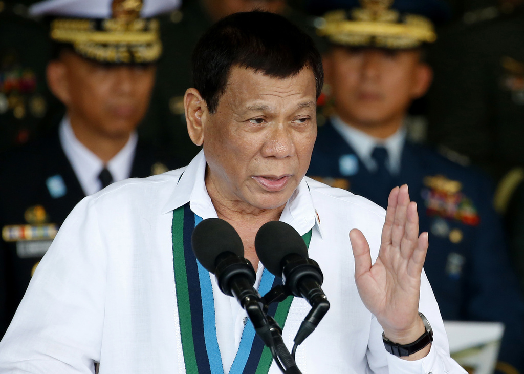 FILE - In this Dec. 20, 2017, file photo, Philippine President Rodrigo Duterte addresses the troops during the 82nd anniversary celebration of the Armed Forces of the Philippines in suburban Quezon city northeast of Manila, Philippines. (AP Photo/Bullit Marquez, File)