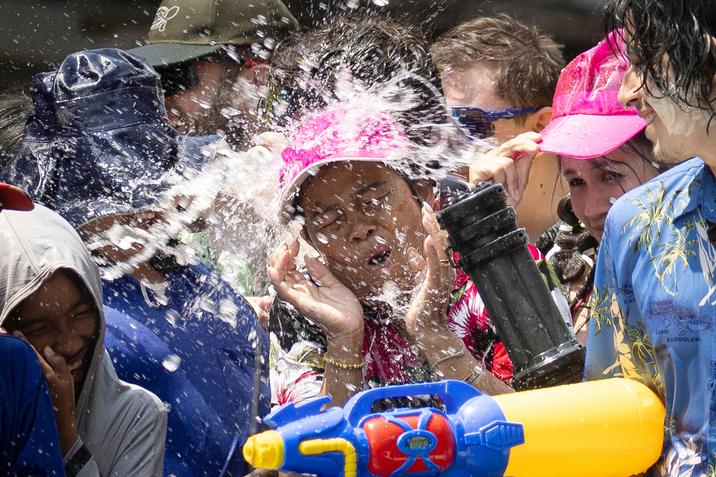 People participate in the Songkran water festival to celebrate the Thai New Year in Prachinburi province, Thailand, Monday, April 13, 2026. (AP Photo/Wason Wanichakorn)