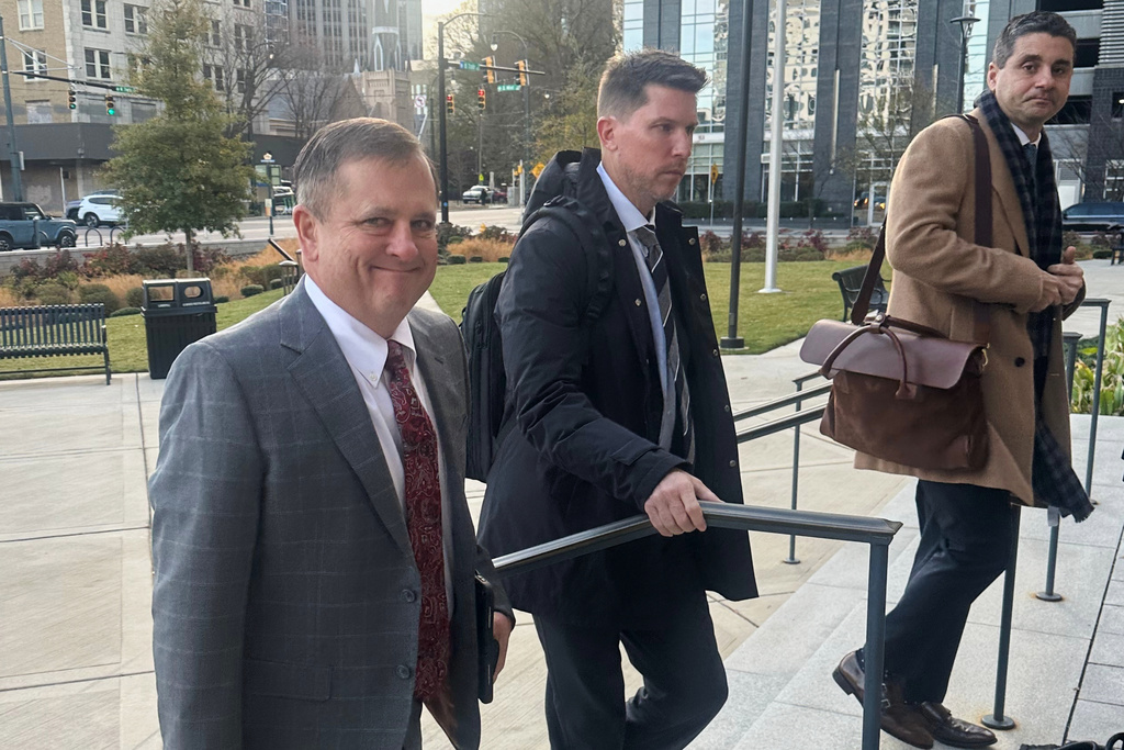 FILE - Front Row Motorsports owner Bob Jenkins, left, and 23XI co-owner Denny Hamlin arrive in the Western District of North Carolina on Monday Dec 1, 2025 in Charlotte, N.C. (AP Photo/Jenna Fryer, File)