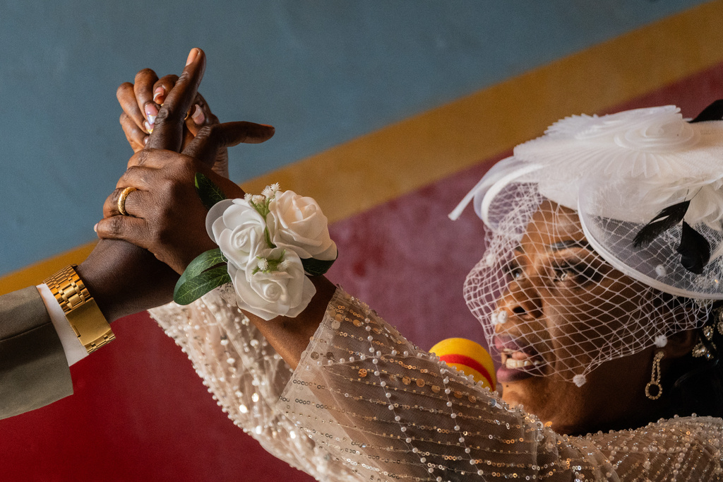 A bride puts a ring on the groom's finger during a wedding ceremony amid an Ebola outbreak in Ituri Province in Bunia, Congo, Saturday, June 6, 2026. (AP Photo/Moses Sawasawa)