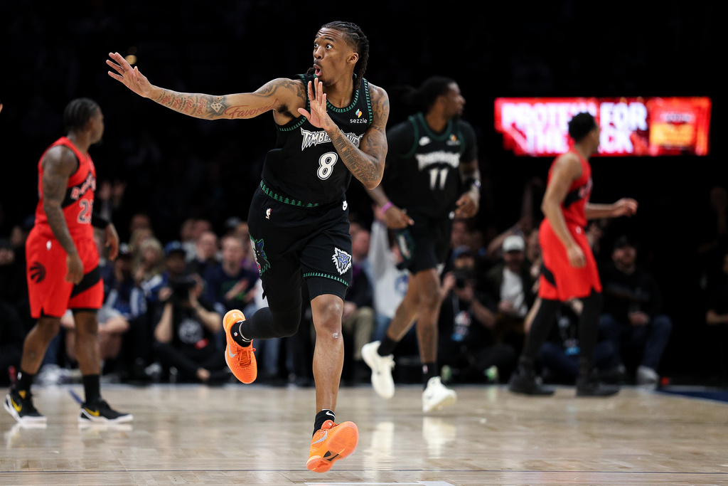 Minnesota Timberwolves guard Bones Hyland (8) celebrates his 3-point basket against the Toronto Raptors during the first half of an NBA basketball game, Thursday, March 5, 2026, in Minneapolis. (AP Photo/Matt Krohn)