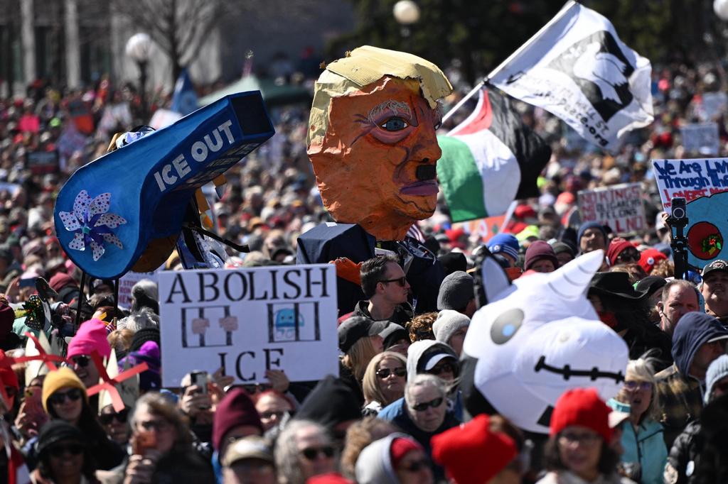 People attend the "No Kings" protest Saturday, March 28, 2026, in St. Paul, Minn. (AP Photo/Tom Baker)