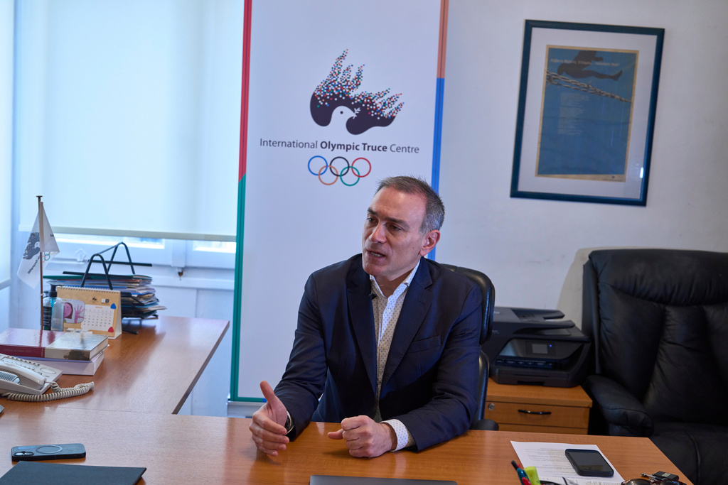 The Director of the International Olympic Truce Centre Constantinos Filis speak to the Associated Press during an interview in Athens, Jan. 28, 2026. (AP Photo/Petros Giannakouris)