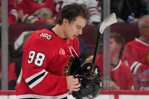 Chicago Blackhawks center Connor Bedard (98) adjusts his helmet during the third period of an NHL hockey game against the Ottawa Senators, Tuesday, Oct. 28, 2025, in Chicago. (AP Photo/Erin Hooley) Chicago Blackhawks center Connor Bedard (98) adjusts his helmet during the third period of an NHL hockey game against the Ottawa Senators, Tuesday, Oct. 28, 2025, in Chicago. (AP Photo/Erin Hooley)