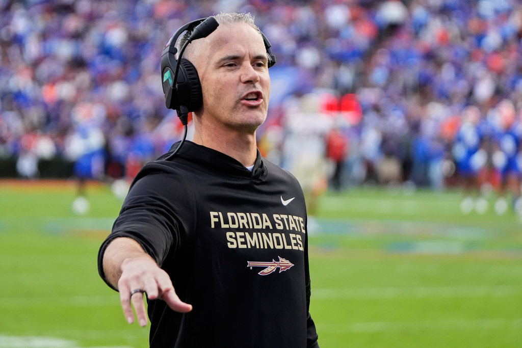 Florida State head coach Mike Norvell has words with an official during the first half of an NCAA college football game against Florida, Saturday, Nov. 29, 2025, in Gainesville, Fla. (AP Photo/John Raoux)