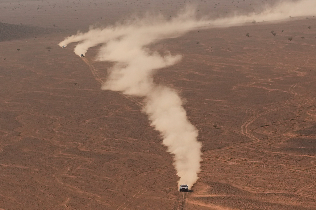 Drivers steer their car during the second stage of the Dakar Rally between Yanbu and Alula, Saudi Arabia, Monday, Jan. 5, 2026. (AP Photo/Thibault Camus)