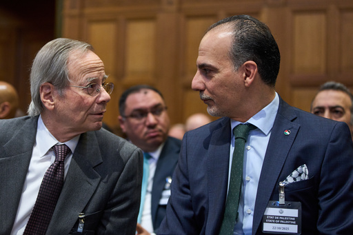 Palestinian Ambassadors to the United Nations Ammar Hijazi, right, waits for the reading of the advisory opinion of the International Court of Justice on what Israel must do to ensure humanitarian aid reaches Palestinians in Gaza and the occupied West Bank, in The Hague, Netherlands, Wednesday, Oct. 22, 2025. (AP Photo/Peter Dejong) Palestinian Ambassadors to the United Nations Ammar Hijazi, right, waits for the reading of the advisory opinion of the International Court of Justice on what Israel must do to ensure humanitarian aid reaches Palestinians in Gaza and the occupied West Bank, in The Hague, Netherlands, Wednesday, Oct. 22, 2025. (AP Photo/Peter Dejong)