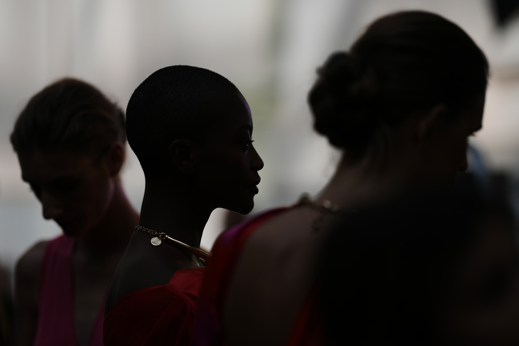 Models wear designs by Silvia Tcherassi backstage before the brand's show at Fashion Week in Madrid, Spain, Wednesday, Sept. 17, 2025. (AP Photo/Manu Fernandez)
