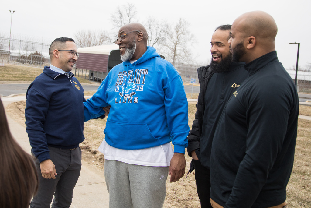 George Calicut Jr., second right, meets his legal team at a prison in Coldwater, Mich., on March 3, 2026, after a judge threw out his 1999 murder conviction and life prison sentence. (Dustin Johnston/University of Michigan Law School via AP)