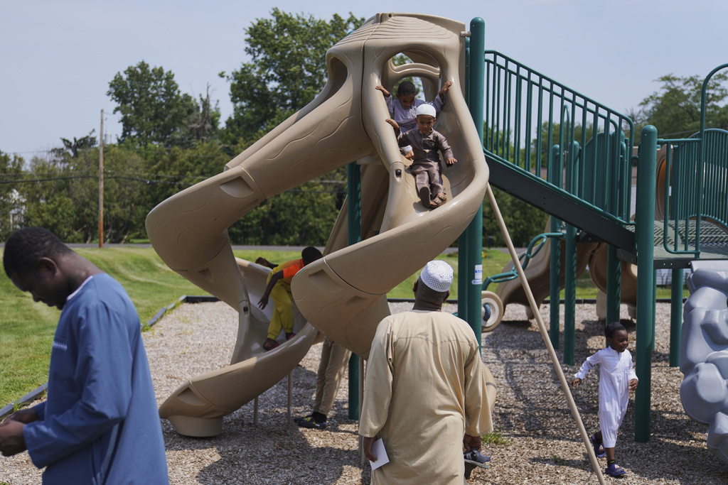 Children play outside after Friday prayer at the Islamic Center of Cedar Rapids on Aug. 8, 2025, in Cedar Rapids, Iowa. (AP Photo/Jessie Wardarski)