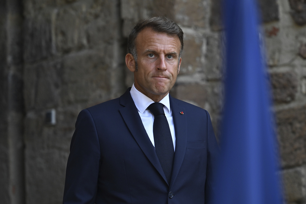 French President Emmanuel Macron arrives to speak after attending a video conference with members of the so-called "coalition of the willing", Sunday, Aug. 17, 2025 at the Fort de Bregancon in Bormes-les-Mimosas, southern France. (AP Photo/Philippe Magoni, Pool)