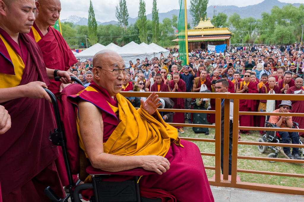 Tibetan spiritual leader the Dalai Lama greets devotees after attending his birthday celebrations in Leh, India, Monday, July 6, 2026. (AP Photo/Tenzin Choejor)