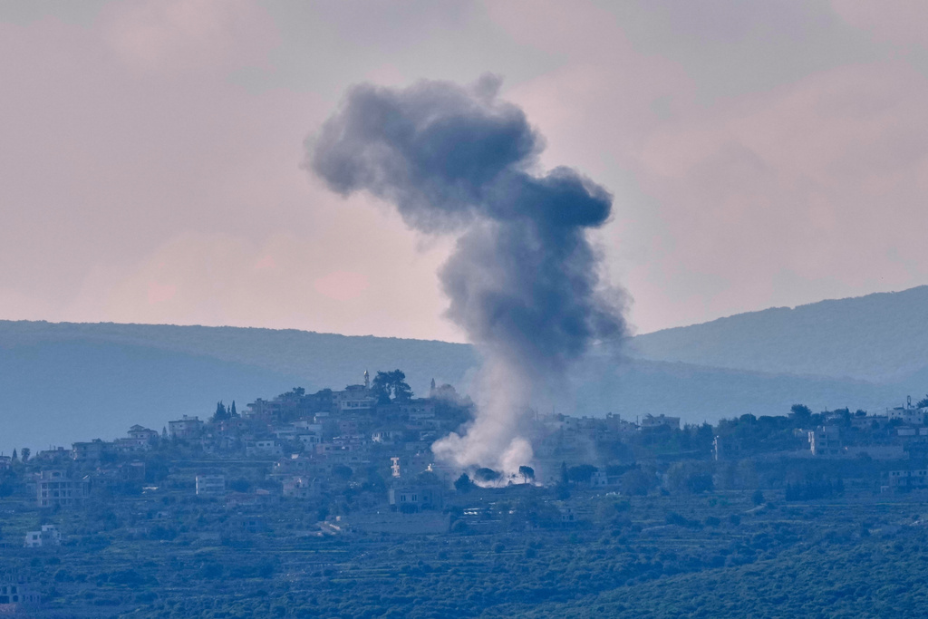 Smoke rises from an Israeli airstrike that hit Zibbikin village as seen from Tyre city, Lebanon, Thursday, March 26, 2026. (AP Photo/Hussein Malla)