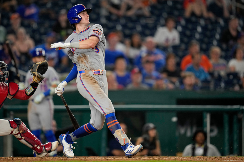 New York Mets' Carson Benge follows through his swing as he hits a two RBI double against the Washington Nationals during the twelfth inning of a baseball game, Monday, May 18, 2026, in Washington. (AP Photo/Jess Rapfogel)
