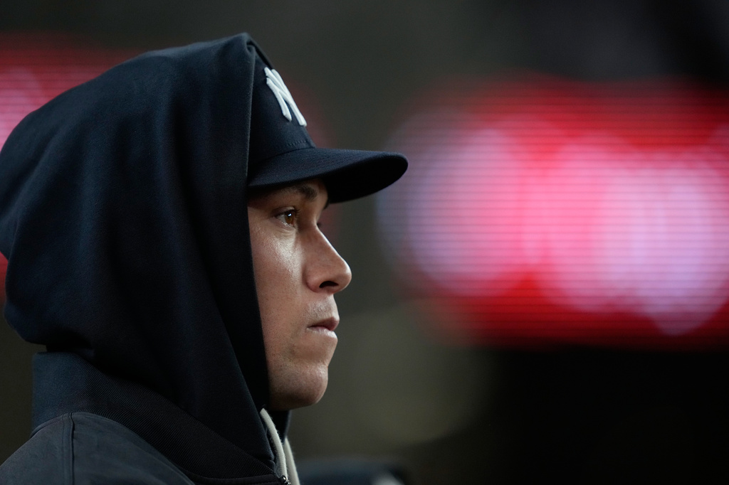 New York Yankees' Aaron Judge looks on from the dugout during the second inning in Game 1 of baseball's American League Wild Card Series against the Boston Red Sox, Tuesday, Sept. 29, 2026, in New York. (AP Photo/Yuki Iwamura)