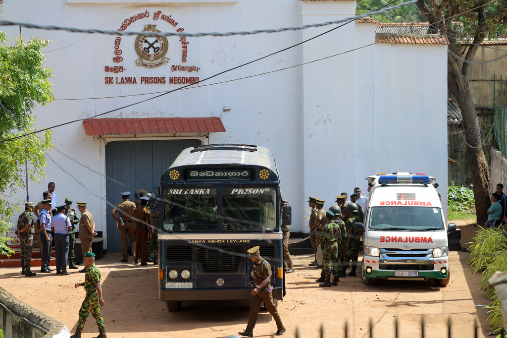 Security personnel stand guard in the compound of a prison where deadly clashes broke out on Sunday, in Negombo, 35 kilometers (22 miles) north of the capital Colombo, Sri Lanka, Monday, July 6, 2026. (AP Photo)