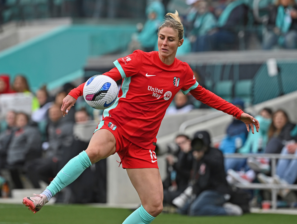 Kansas City Current forward Haley Hopkins (13) makes a play on the ball against the Portland Thorns FC during an NWSL soccer match in Kansas City, Mo., Saturday, March 15, 2025. (AP Photo/Peter Aiken)