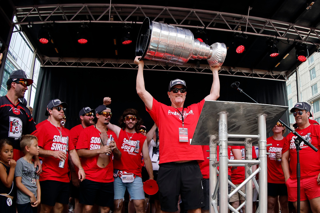 Carolina Hurricanes majority owner Tom Dundon holds the Stanley Cup in the air during the NHL hockey club's championship celebration in Raleigh, N.C., Saturday, June 20, 2026. (AP Photo/Karl DeBlaker)