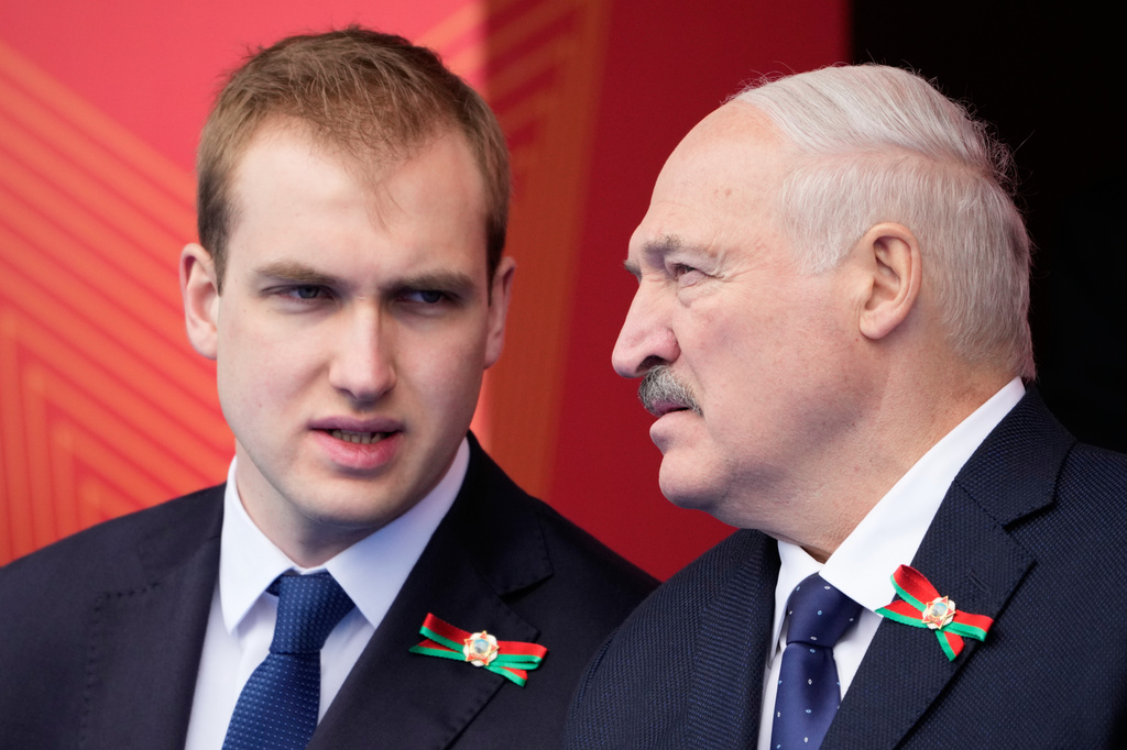 Belarusian President Alexandr Lukashenko, right, speaks with his son Nikolai during the Victory Day military parade in Moscow, Saturday, May 9, 2026, during celebrations of the 81st anniversary of the Soviet Union's victory over Nazi Germany during the World War II. (AP Photo/Pavel Bednyakov, Pool)