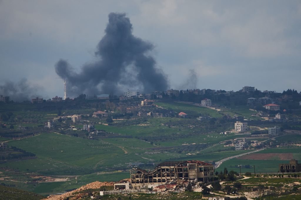 Smoke rises following an Israeli bombardment in southern Lebanon as seen from northern Israel, Sunday, April 12, 2026. (AP Photo/Ariel Schalit)
