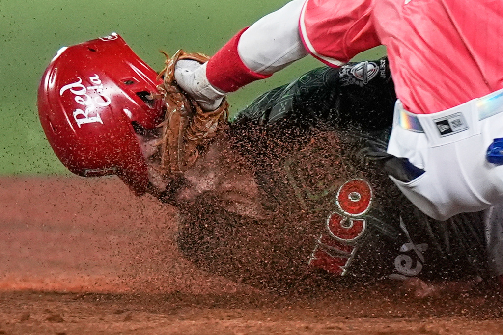 FILE - Mexico Reds catcher Santiago Chavez is tagged out by Puerto Rico's Andrew Velazquez during a Caribbean Series baseball game in Guadalajara, Mexico, Feb. 3, 2026. (AP Photo/Fernando Llano, File)