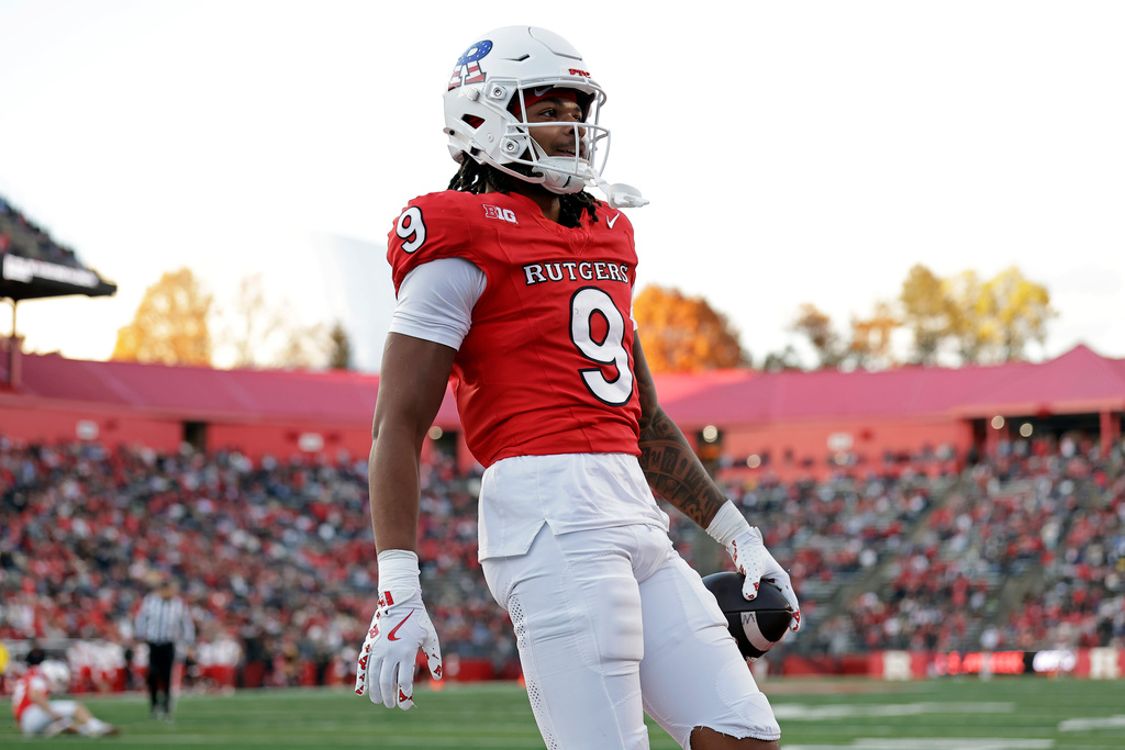 Rutgers wide receiver Ian Strong (9) reacts after scoring a touchdown during the first half of an NCAA college football game against Maryland, Saturday, Nov. 8, 2025, in Piscataway, N.J. (AP Photo/Adam Hunger)