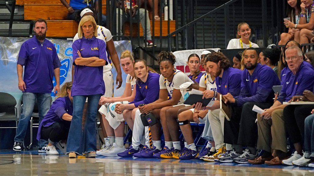 LSU head coach Kim Mulkey, second from upper leftfront, watches her team during the second quarter of an NCAA college basketball game against Marist at the Paradise Jam tournament Friday, Nov. 28, 2025, in St. Thomas, U.S. Virgin Islands. (Bill Kiser/The Virgin Islands Daily News via AP)