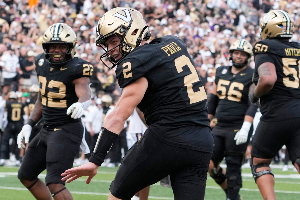 Vanderbilt quarterback Diego Pavia (2) celebrates his touchdown during the second half of an NCAA college football game against LSU, Saturday, Oct. 18, 2025, in Nashville, Tenn. (AP Photo/George Walker IV)