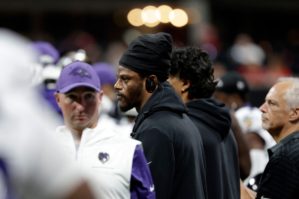Injured Baltimore Ravens quarterback Lamar Jackson watches from the sideline during the first half of an NFL football game against the Atlanta Falcons, Sunday, Oct. 11, 2026, in Atlanta. (AP Photo/Erik S. Lesser)
