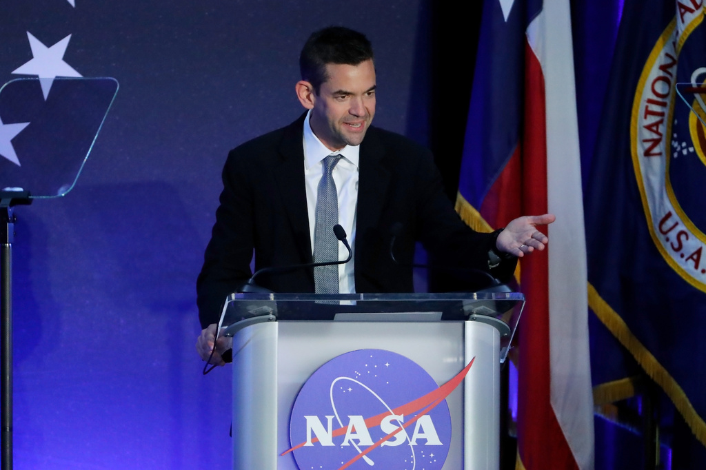 Jared Isaacman, NASA Administrator, speaks before introducing the Artemis II crew during a return event Saturday, April 11, 2026, at Ellington Field in Houston. (AP Photo/Michael Wyke)