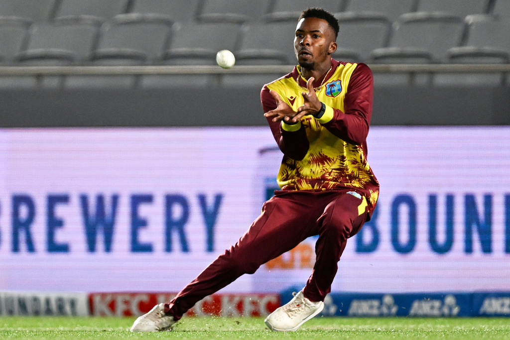 West Indies fielder Romario Shepherd takes a catch to dismiss New Zealand's Tim Robinson during the T20 cricket international between New Zealand and the West Indies in Auckland, New Zealand, Wednesday, Nov. 5, 2025. (Andrew Cornaga/Photosport via AP)