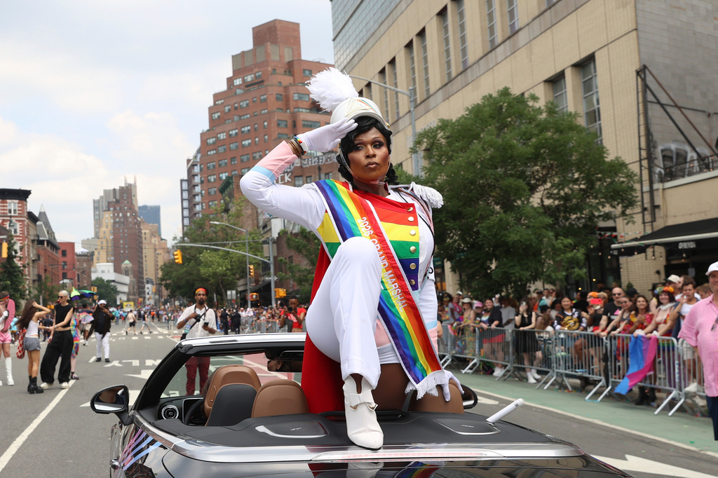 Peppermint, one of the official Grand Marshals for the 2026 NYC Pride March, salutes to parade-goers, Sunday, June 28, 2026 in New York. (AP Photo/Pamela Smith)