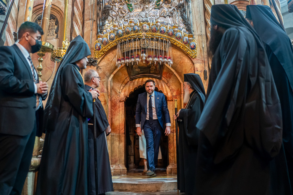 U.S. Vice President JD Vance, center, tours The Church of the Holy Sepulchre in the Old City of Jerusalem Thursday, Oct. 23, 2025. (Nathan Howard/Pool Photo via AP)
