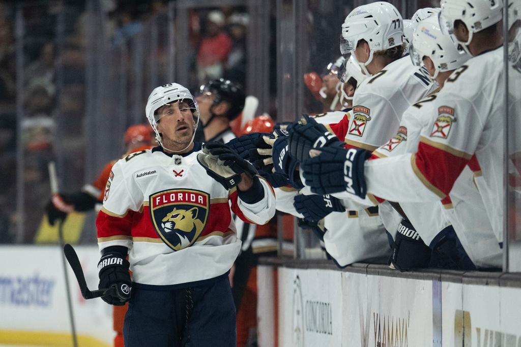 Florida Panthers left wing Brad Marchand (63) celebrates his goal with the bench during the first period of an NHL hockey game against the Anaheim Ducks, Tuesday, Nov. 4, 2025, in Anaheim, Calif. (AP Photo/Kyusung Gong)