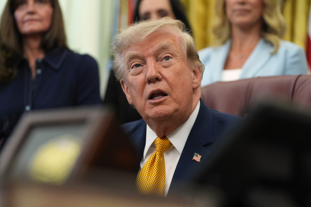President Donald Trump speaks during a meeting about military families, in the Oval Office of the White House, Monday, Aug. 3, 2026, in Washington. (AP Photo/Alex Brandon)