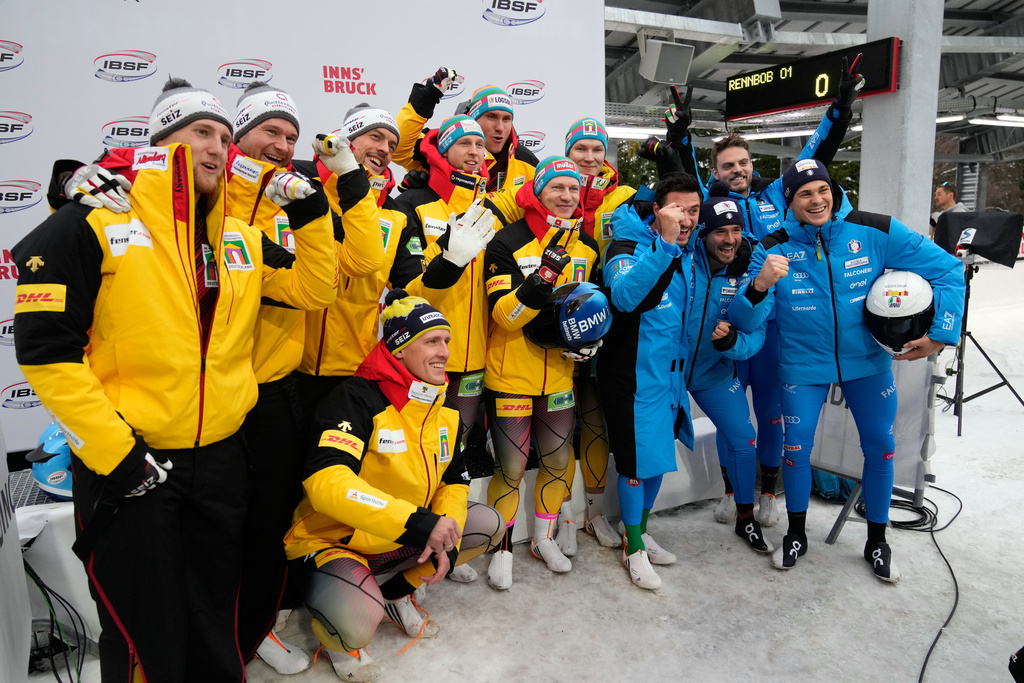 Second place Johannes Lochner, Thorsten Margis, Joern Wenzel and Georg Fleischhauer, of Germany, winners Francesco Friedrich, Tim Becker, Alexander Schueller and Felix Straub, of Germany, and third placed Patrick Baumgartner, Eric Fantazzini, Robert Mircea and Lorenzo Bilotti, of Italy, from left, pose after the 4-man bobsleigh race at the Bobsleigh World Cup in Innsbruck, Austria, Sunday, Nov. 30, 2025. (AP Photo/Matthias Schrader)