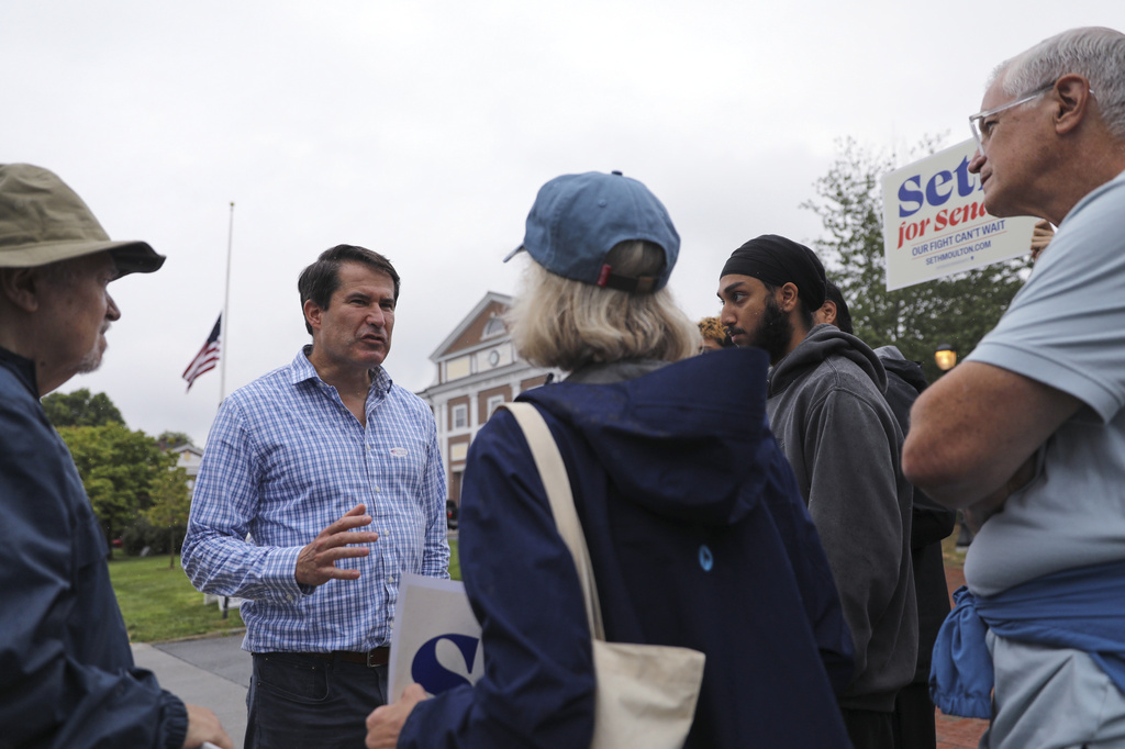 U.S. Rep. Seth Moulton campaigns outside Cary Hall, the town hall and polling place in Lexington, Mass., Tuesday, Sept. 1, 2026. (Lauren Feeney/Lexington Observer via AP)