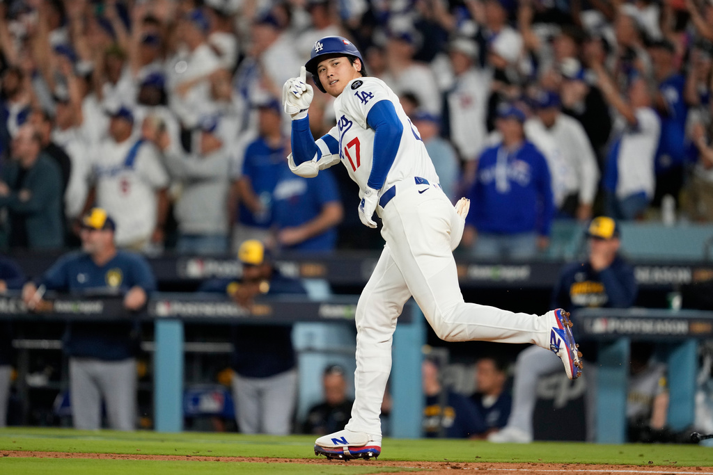 Los Angeles Dodgers' Shohei Ohtani celebrates his home run against the Milwaukee Brewers during the seventh inning in Game 4 of baseball's National League Championship Series, Friday, Oct. 17, 2025, in Los Angeles. (AP Photo/Ashley Landis)
