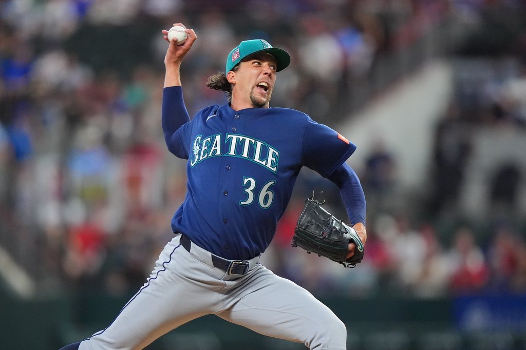 Seattle Mariners starting pitcher Logan Gilbert throws during the first inning of a baseball game against the Texas Rangers, Sunday, July 26, 2026, in Arlington, Texas. (AP Photo/LM Otero)