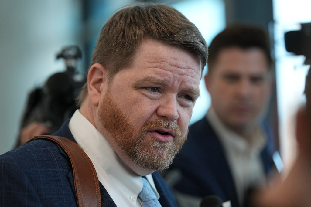 Mark Bankston, an attorney for relatives of the victims of the 2012 Sandy Hook School shooting, speaks to the media following a hearing at the county courthouse in Austin, Texas, Thursday, April 30, 2026. (AP Photo/Eric Gay)